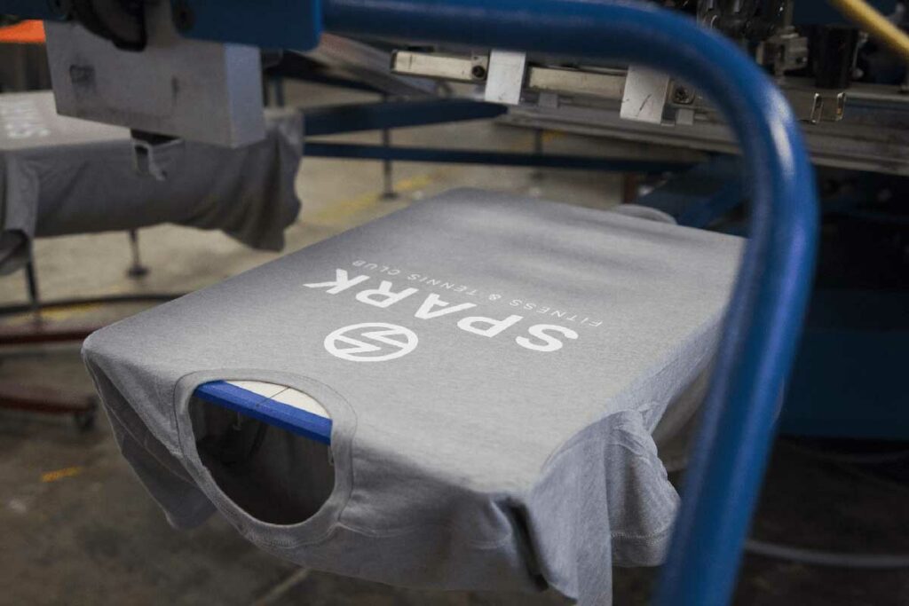 grey t-shirt on a screen printer