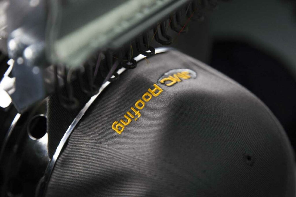 baseball cap getting embroidered on it
