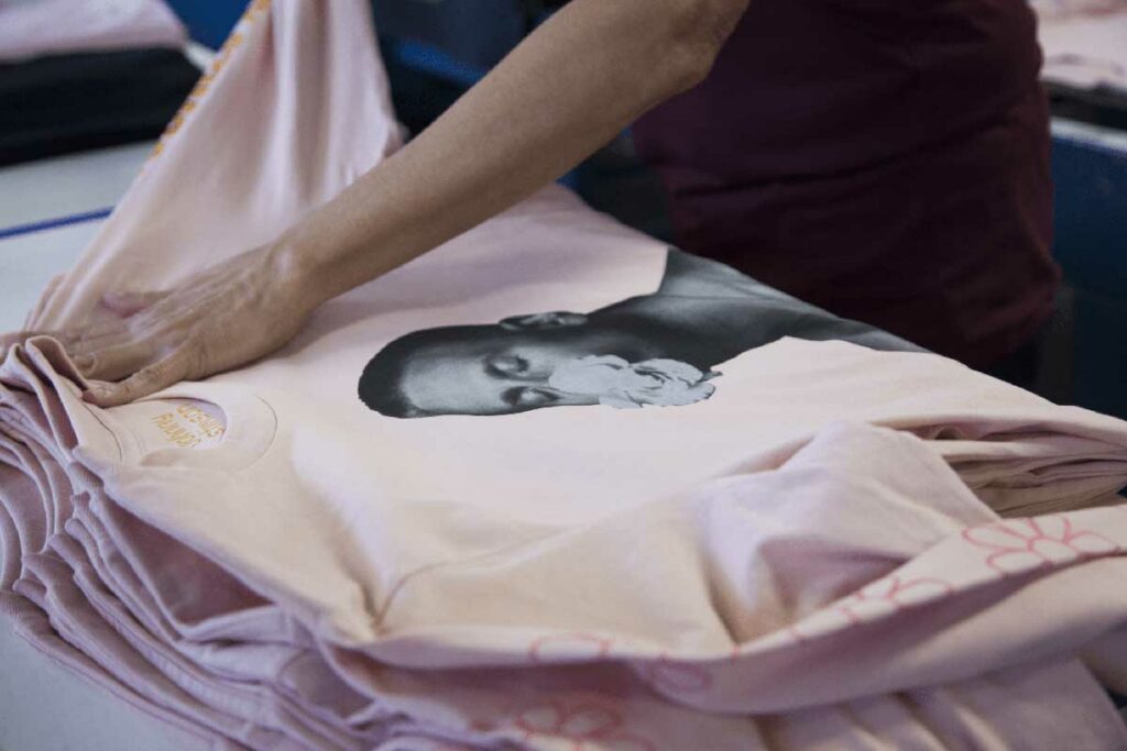 pink long sleeve shirt with a photo screen printed onto it