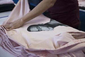 pink long sleeve shirt with a photo screen printed onto it