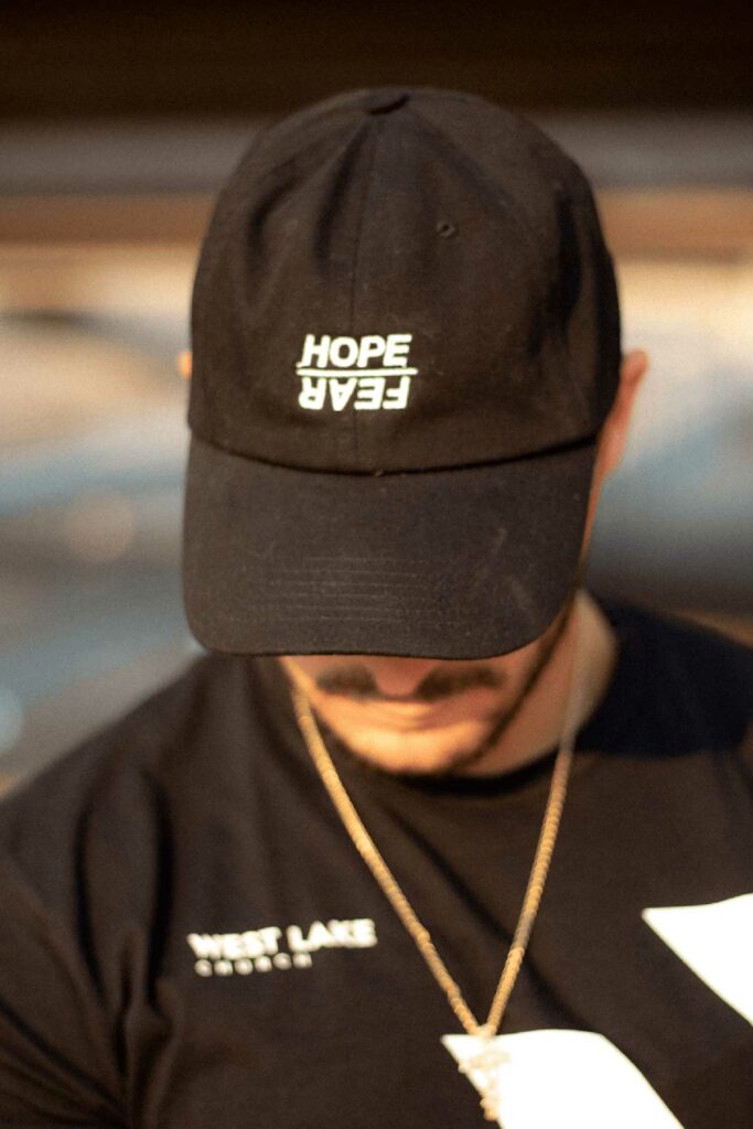 black baseball hat with hope over fear embroidered on it